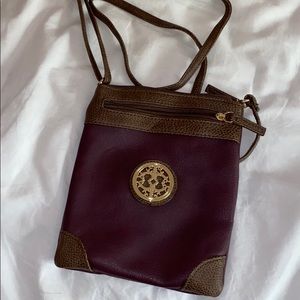 Burgundy and brown crossbody with gold emblem
